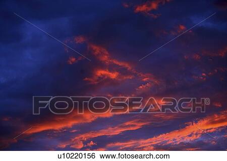 Sunset in the clouds View Large Photo Image Stock Photograph - Sunset in the clouds. Fotosearch