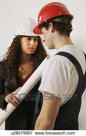Stock Photo - Supervisor and tradesman. Fotosearch
