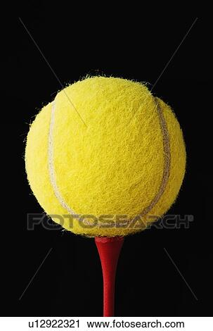 Tennis ball on a golf tee View Large Photo Image Stock Image - Tennis ball on a golf tee. Fotosearch
