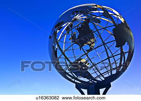 Stock Image - Terrestrial sphere on blue background. Fotosearch
