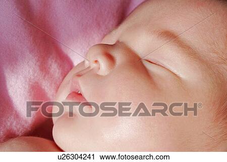 Stock Image - The face of a sleeping baby. Fotosearch