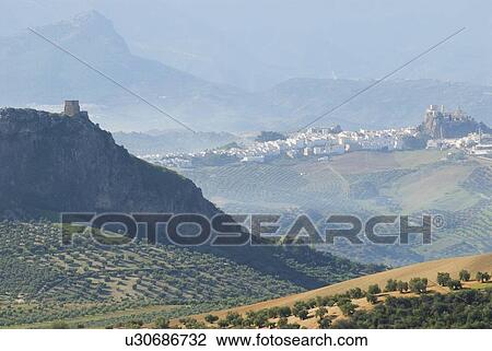 The Iron Castle - (Castillo de Hierro) at Pruna, Seville with the hilltop village of Olvera, Cadiz, in the background. View Large Photo Image Stock Image - The Iron Castle - (Castillo de Hierro) at Pruna, Seville with the hilltop village of Olvera, Cadiz, in the background. . Fotosearch