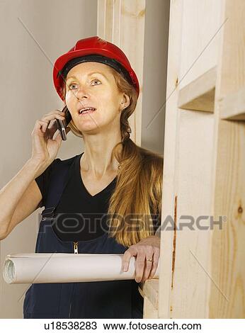 Tradeswoman at work View Large Photo Image Stock Image - Tradeswoman at work. Fotosearch