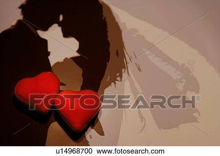 Stock Image - Two hearts on image of wedding couple. Fotosearch