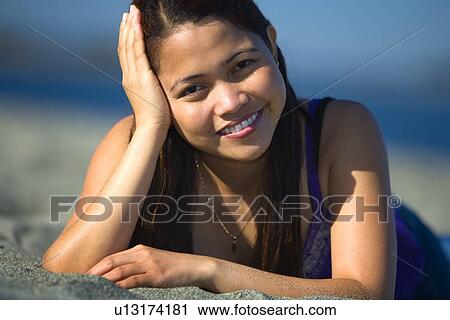 Stock Image - Woman at the beach. Fotosearch