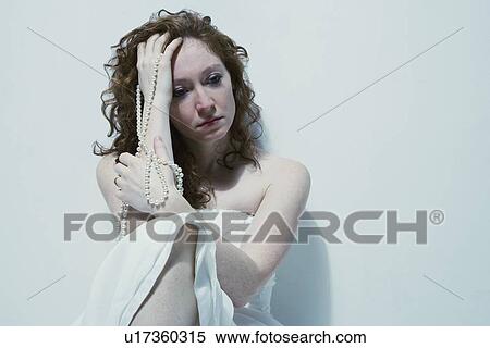 Stock Photography - Woman feeling sad. Fotosearch