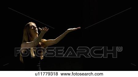 Woman holding arms out View Large Photo Image Stock Photo - Woman holding arms out . Fotosearch
