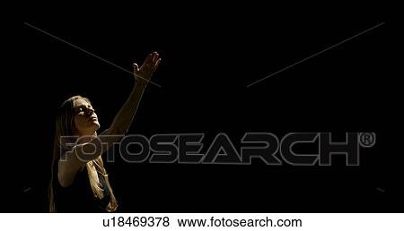 Woman holding one arm up View Large Photo Image Stock Photo - Woman holding one arm up . Fotosearch