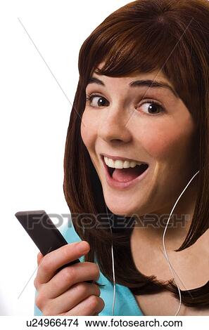 Woman listening to music player View Large Photo Image Picture - Woman listening to music player. Fotosearch