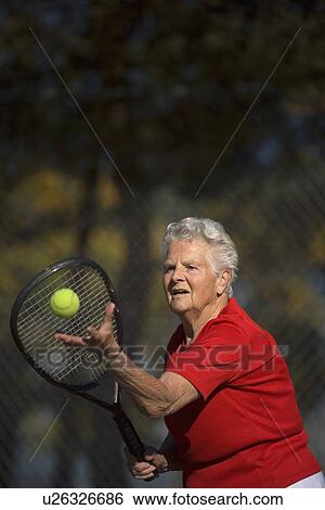 Woman playing tennis View Large Photo Image Stock Photograph - Woman playing tennis. Fotosearch