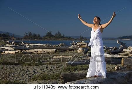 Woman praying at the beach View Large Photo Image Stock Photography - Woman praying at the beach. Fotosearch