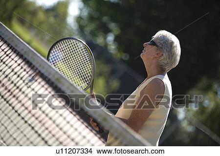 Picture - Woman ready to play tennis. Fotosearch