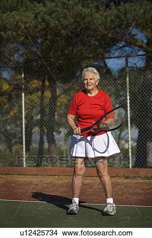 Picture - Woman ready to play tennis. Fotosearch