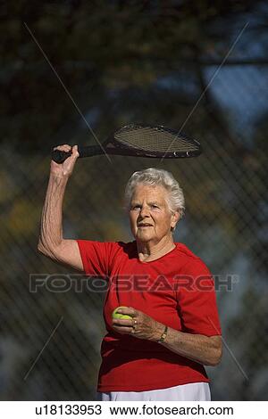 Woman ready to serve tennis ball View Large Photo Image Stock Image - Woman ready to serve tennis ball. Fotosearch