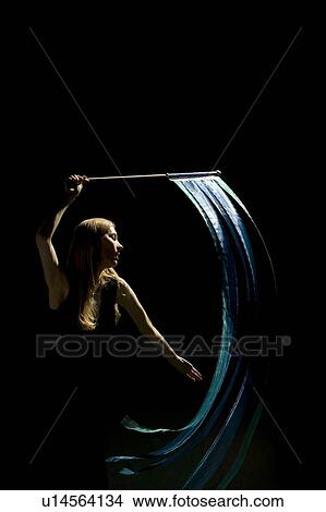 Picture - Woman waving flag in black background. Fotosearch