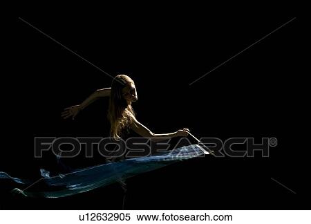 Stock Photography - Woman waving flag in black background. Fotosearch