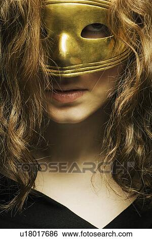Woman wearing a mask View Large Photo Image Stock Photograph - Woman wearing a mask. Fotosearch