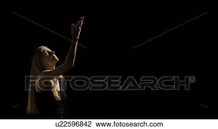 Stock Image - Woman with one arm up . Fotosearch
