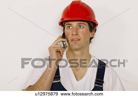 Stock Photo - Worker on the phone. Fotosearch