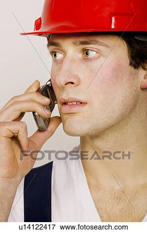 Stock Photo - Worker on the phone. Fotosearch
