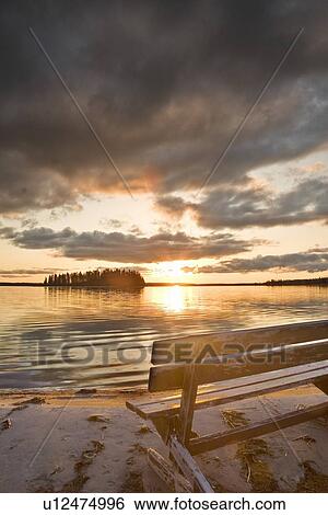 A bench overlooking Astotin Lake at Elk Island National Park, Alberta, Canada View Large Photo Image Stock Photograph - A bench overlooking Astotin Lake at Elk Island National Park, Alberta, Canada . Fotosearch