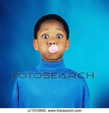 A boy blowing a bubble View Large Photo Image Stock Photography - A boy blowing a bubble. Fotosearch