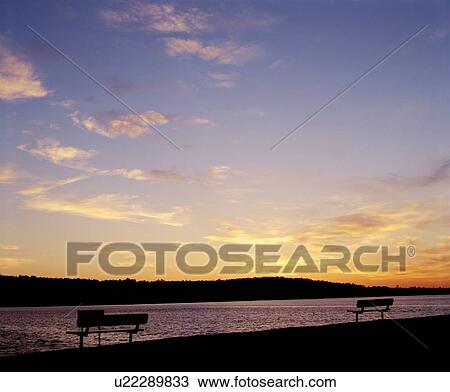 Stock Image - A lake scene at sunset. Fotosearch