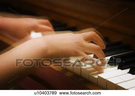 A person playing the piano View Large Photo Image Stock Photo - A person playing the piano. Fotosearch