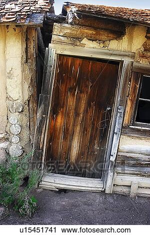 Stock Image - Abandoned house with door. Fotosearch