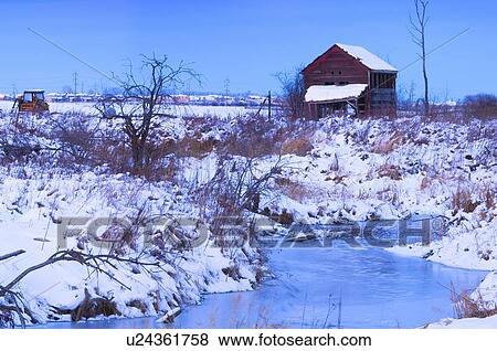 Stock Photo - Abandoned shack near frozen winter creek . Fotosearch