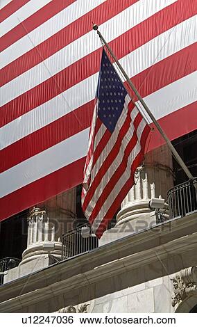 American flag in front of the Stock Exchange on Wall Street, Lower Manhattan, New York City, New York, USA View Large Photo Image Stock Photograph - American flag in front of the Stock Exchange on Wall Street, Lower Manhattan, New York City, New York, USA. Fotosearch