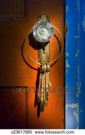 Stock Photography - Antique glass doorknob with keys. Fotosearch