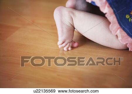 Stock Photo - Baby girl's feet. Fotosearch