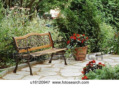 Bench in a garden setting View Large Photo Image Stock Photo - Bench in a garden setting. Fotosearch