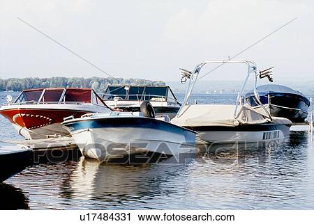 Stock Image - Boats parked at a dock. Fotosearch