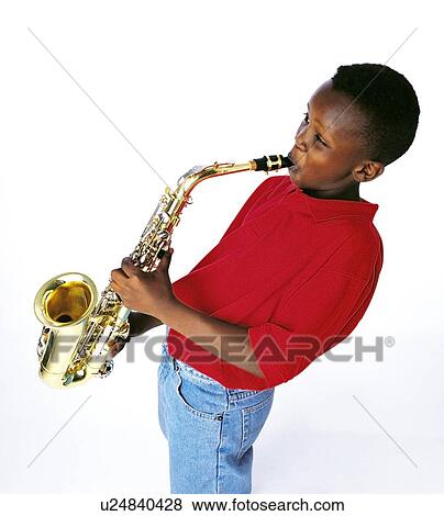 Boy playing the saxophone View Large Photo Image Stock Photo - Boy playing the saxophone. Fotosearch