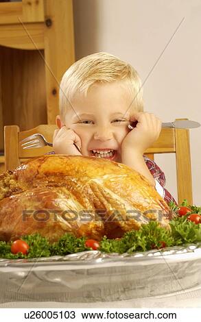 Boy ready to eat cooked turkey View Large Photo Image Stock Image - Boy ready to eat cooked turkey. Fotosearch