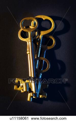 Stock Image - Bundle of old skeleton keys . Fotosearch