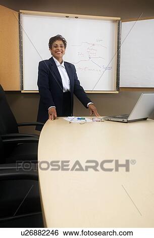 Businesswoman giving presentation View Large Photo Image Stock Photograph - Businesswoman giving presentation. Fotosearch