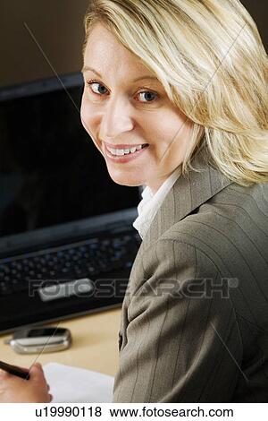 Stock Photo - Businesswoman posing for camera. Fotosearch
