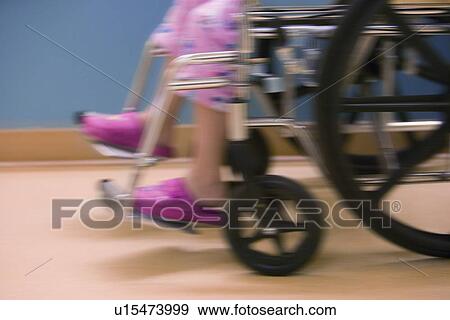 Child in hospital wheelchair View Large Photo Image Stock Photo - Child in hospital wheelchair. Fotosearch