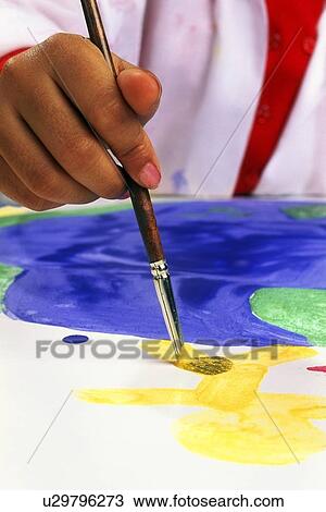 Stock Image - Child painting. Fotosearch