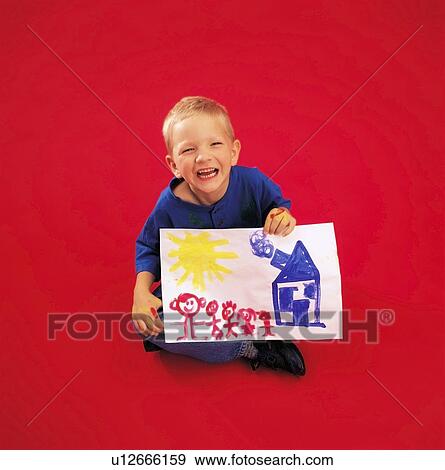 Stock Photo - Child posing and holding painting. Fotosearch