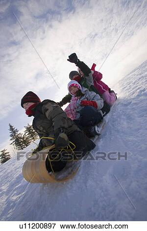 Children Tobogganing View Large Photo Image Stock Photo - Children Tobogganing . Fotosearch