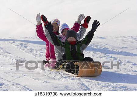 Children tobogganing View Large Photo Image Stock Photo - Children tobogganing. Fotosearch