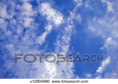 Stock Image - Clouds in a blue sky. Fotosearch
