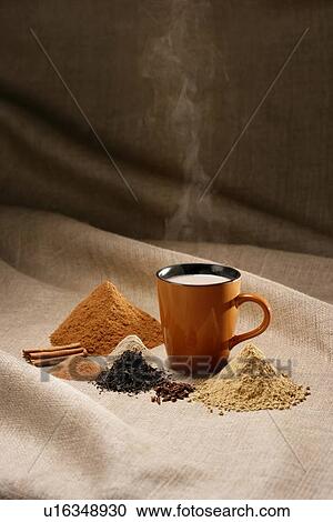 Stock Image - Coffee mug with spices. Fotosearch
