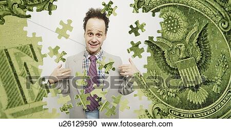 Stock Image - Composite of a US dollar bill and a goofy business man. Fotosearch