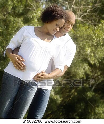 Couple expecting child View Large Photo Image Stock Photograph - Couple expecting child. Fotosearch