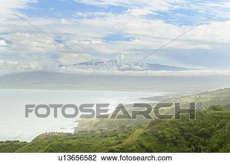 Distant view of Maui's Haleakala crater with white clouds in Hawaii, USA View Large Photo Image Stock Image - Distant view of Maui's Haleakala crater with white clouds in Hawaii, USA . Fotosearch